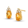 Thumbnail Image 1 of Oval Citrine and 1/10 CT. T.W. Diamond Stud Earrings in 10K Gold