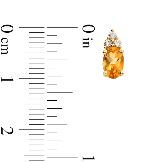Oval Citrine and 1/10 CT. T.w. Diamond Stud Earrings in 10K Gold