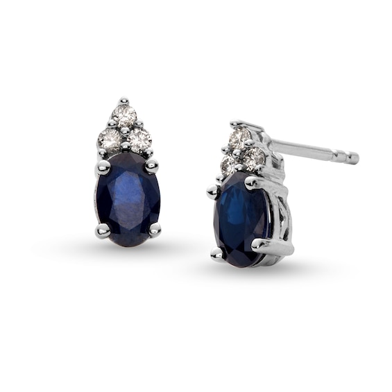 Oval Blue Sapphire and 1/10 CT. T.w. Diamond Stud Earrings in 10K White Gold