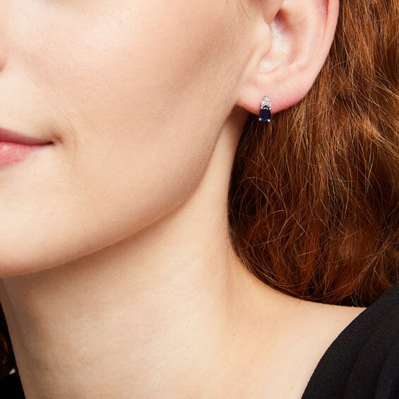 Oval Blue Sapphire and 1/10 CT. T.w. Diamond Stud Earrings in 10K White Gold