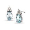 Thumbnail Image 0 of Oval Aquamarine and 1/10 CT. T.W. Diamond Stud Earrings in 10K White Gold