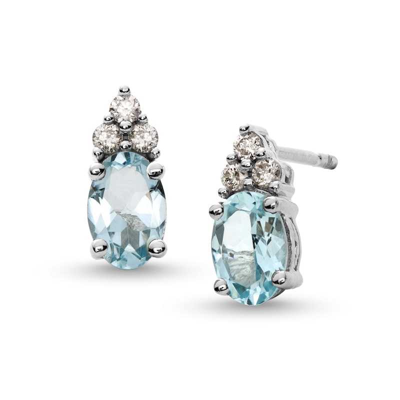 Main Image 1 of Oval Aquamarine and 1/10 CT. T.W. Diamond Stud Earrings in 10K White Gold