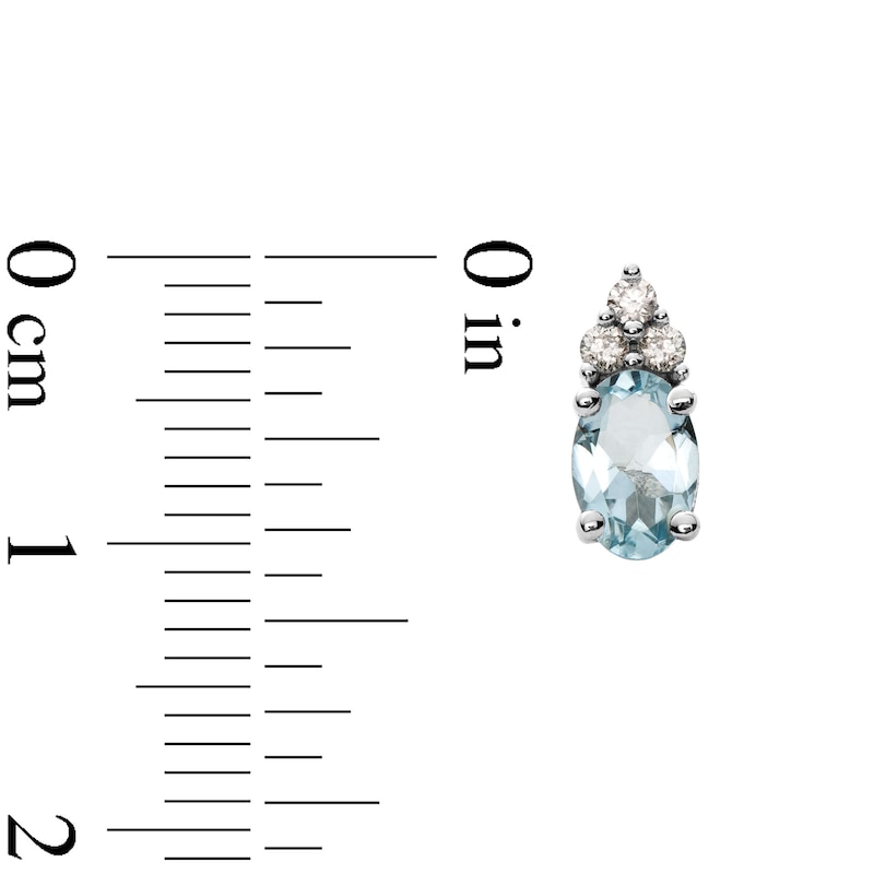 Oval Aquamarine and 1/10 CT. T.W. Diamond Stud Earrings in 10K White Gold