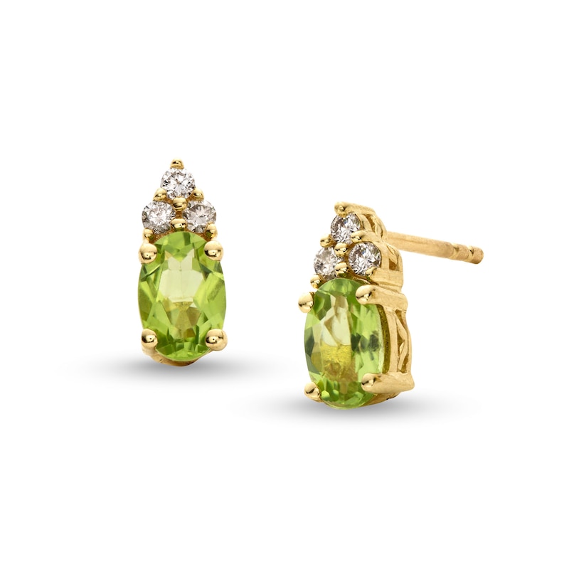 Main Image 1 of Oval Peridot and 1/10 CT. T.W. Diamond Stud Earrings in 10K Gold