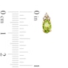 Thumbnail Image 3 of Oval Peridot and 1/10 CT. T.W. Diamond Stud Earrings in 10K Gold