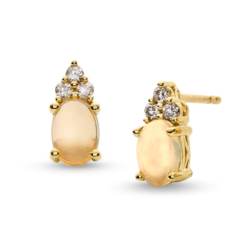 Main Image 1 of Oval Opal and 1/10 CT. T.W. Diamond Stud Earrings in 10K Gold