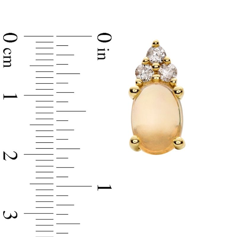 Oval Opal and 1/10 CT. T.W. Diamond Stud Earrings in 10K Gold