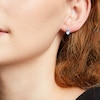 Thumbnail Image 2 of Oval Swiss Blue Topaz and 1/10 CT. T.W. Diamond Stud Earrings in 10K Gold