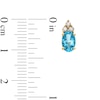 Thumbnail Image 3 of Oval Swiss Blue Topaz and 1/10 CT. T.W. Diamond Stud Earrings in 10K Gold