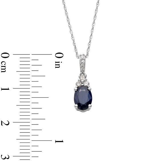 Oval Blue Sapphire and 1/15 CT. T.w. Diamond Pendant in 10K White Gold