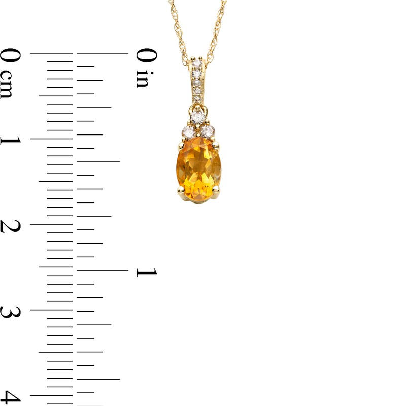 Main Image 3 of Oval Citrine and 1/15 CT. T.W. Diamond Pendant in 10K Gold