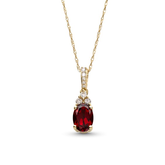 Oval Garnet and 1/15 CT. T.w. Diamond Pendant in 10K Gold