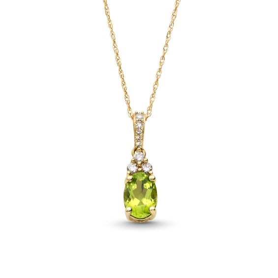Oval Peridot and 1/15 CT. T.w. Diamond Pendant in 10K Gold