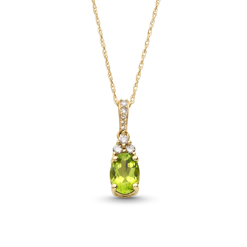 Main Image 1 of Oval Peridot and 1/15 CT. T.W. Diamond Pendant in 10K Gold