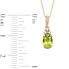 Thumbnail Image 3 of Oval Peridot and 1/15 CT. T.W. Diamond Pendant in 10K Gold