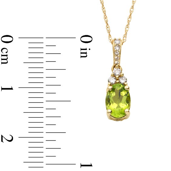 Oval Peridot and 1/15 CT. T.w. Diamond Pendant in 10K Gold