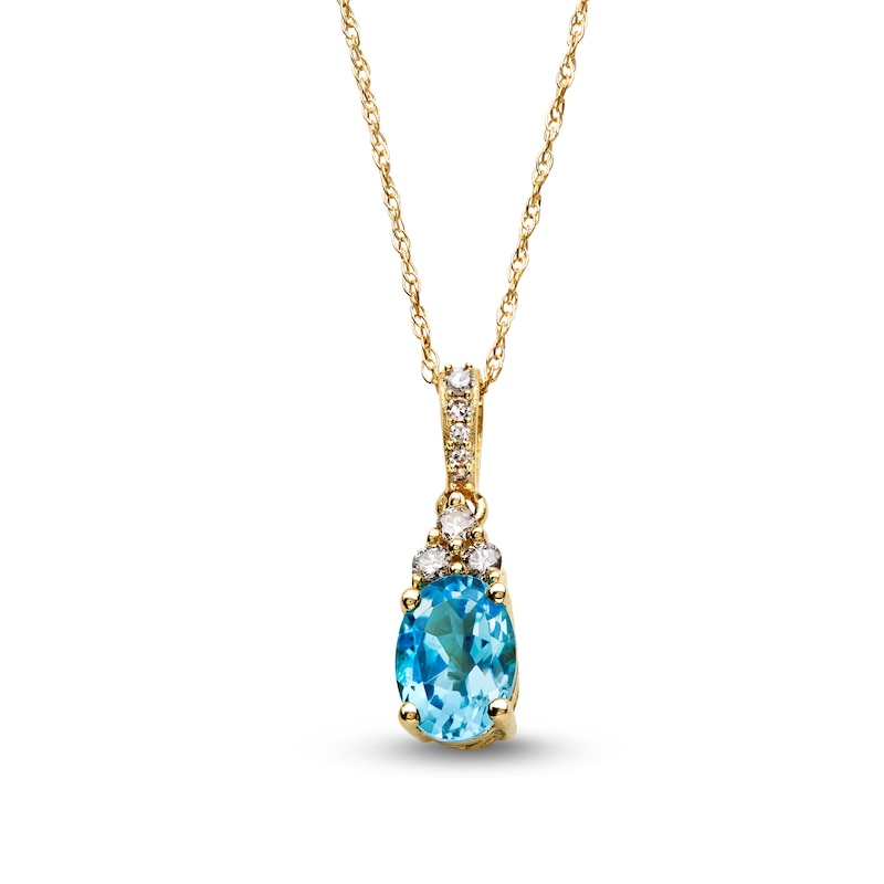 Main Image 1 of Oval Swiss Blue Topaz and 1/15 CT. T.W. Diamond Pendant in 10K Gold