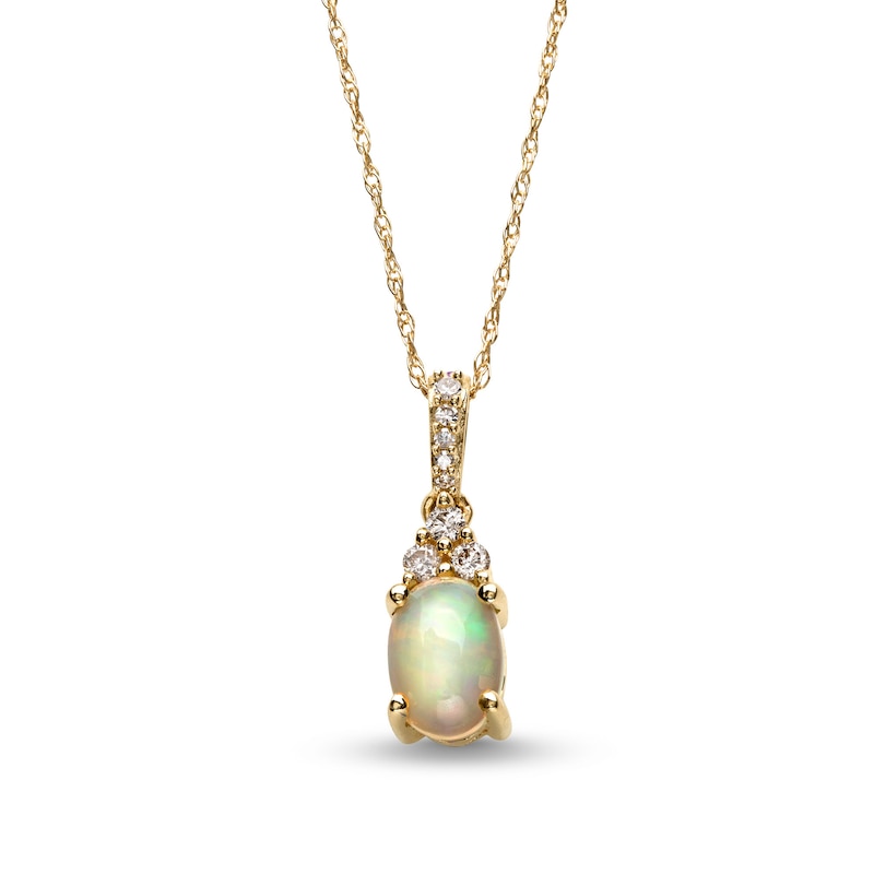 Oval Opal and 1/15 CT. T.W. Diamond Pendant in 10K Gold