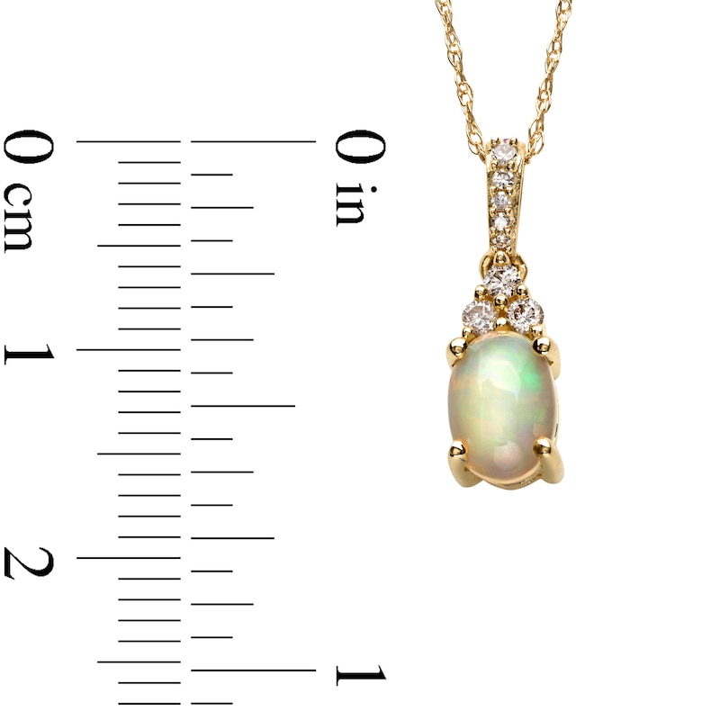 Oval Opal and 1/15 CT. T.W. Diamond Pendant in 10K Gold