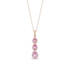 Thumbnail Image 1 of Pear-Shaped Pink and White Lab-Created Sapphire Frame Three Stone Linear Drop Pendant in 10K Rose Gold