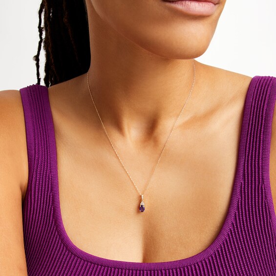 Oval Amethyst and 1/15 CT. T.w. Diamond Pendant in 10K Gold