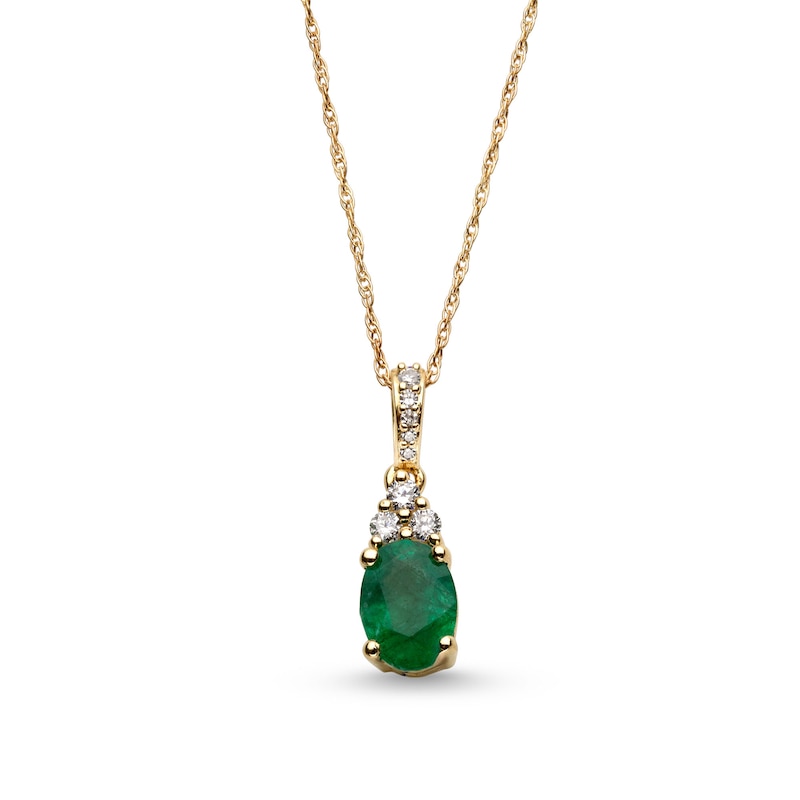 Main Image 1 of Oval Emerald and 1/15 CT. T.W. Diamond Pendant in 10K Gold