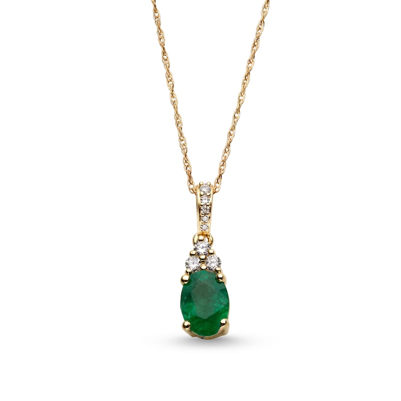 Oval Emerald and 1/15 CT. T.W. Diamond Pendant in 10K Gold | Zales