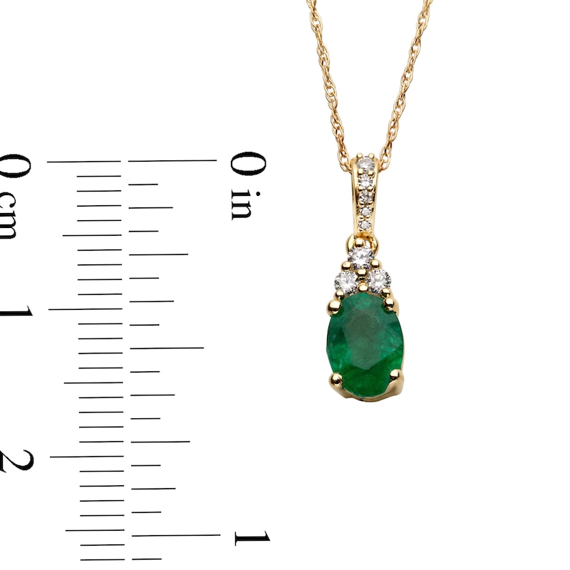 Main Image 3 of Oval Emerald and 1/15 CT. T.W. Diamond Pendant in 10K Gold