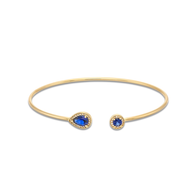 Main Image 1 of Pear-Shaped and Round Blue Lab-Created Sapphire with 1/8 CT. T.W. Diamond Open Flex Bangle in 10K Gold