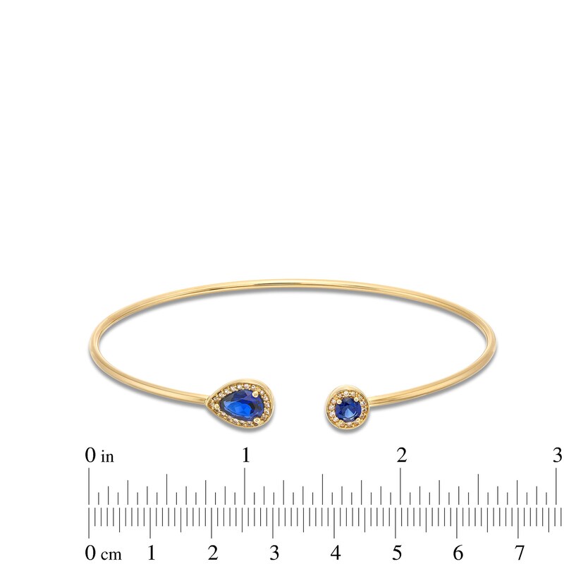 Main Image 3 of Pear-Shaped and Round Blue Lab-Created Sapphire with 1/8 CT. T.W. Diamond Open Flex Bangle in 10K Gold