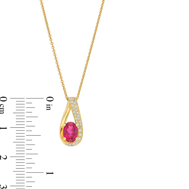 Oval Lab-Created Ruby and 1/6 CT. T.W. Diamond Teardrop Pendant in 10K Gold