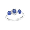 Thumbnail Image 0 of Oval Blue Lab-Created Sapphire and 1/8 CT. T.W. Diamond Starburst Frame Three Stone Ring in 10K White Gold