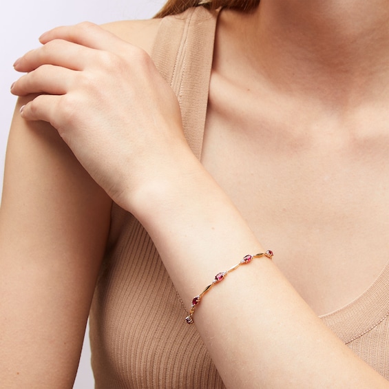 Oval Lab-Created Ruby, Diamond Accent and Rice Bead Alternating Bracelet in 10K Gold - 7.25"