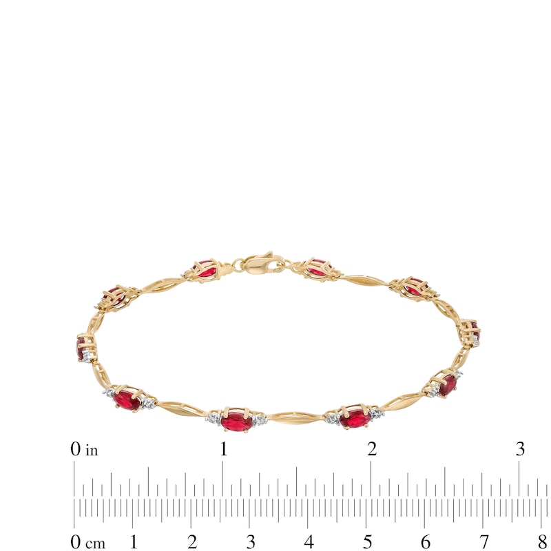 Oval Lab-Created Ruby, Diamond Accent and Rice Bead Alternating Bracelet in 10K Gold - 7.25"