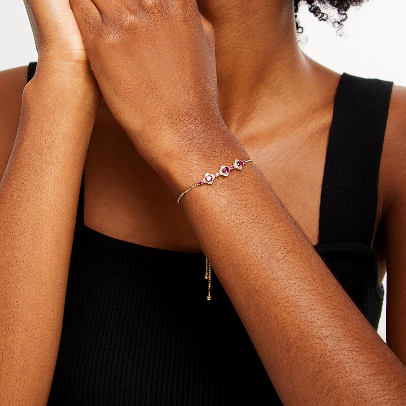 Main Image 2 of Oval Certified Ruby and 1/5 CT. T.W. Diamond Flower Frame Three Stone Bolo Bracelet in 10K Gold - 9&quot;