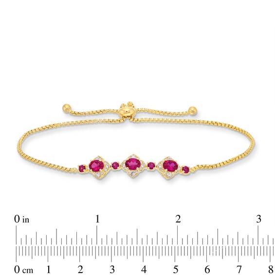 Oval Certified Ruby and 1/5 CT. T.w. Diamond Flower Frame Three Stone Bolo Bracelet in 10K Gold - 9"