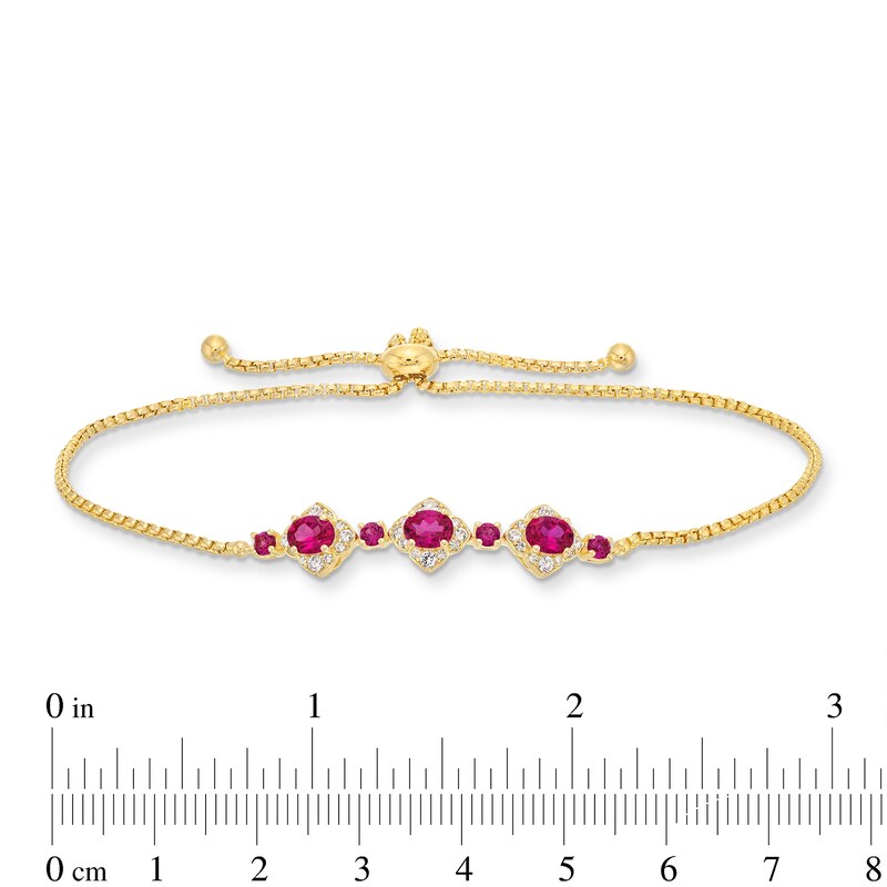 Main Image 3 of Oval Certified Ruby and 1/5 CT. T.W. Diamond Flower Frame Three Stone Bolo Bracelet in 10K Gold - 9&quot;