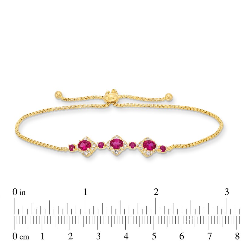 Oval Certified Ruby and 1/5 CT. T.W. Diamond Flower Frame Three Stone Bolo Bracelet in 10K Gold - 9"