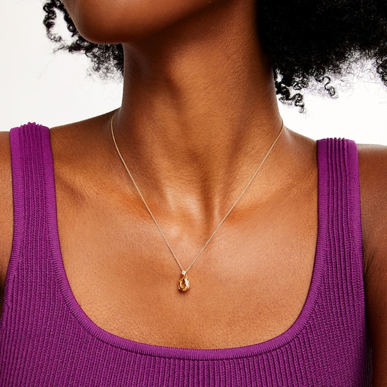 Pear-Shaped Citrine and 1/20 CT. Diamond Drop Pendant in 10K Gold