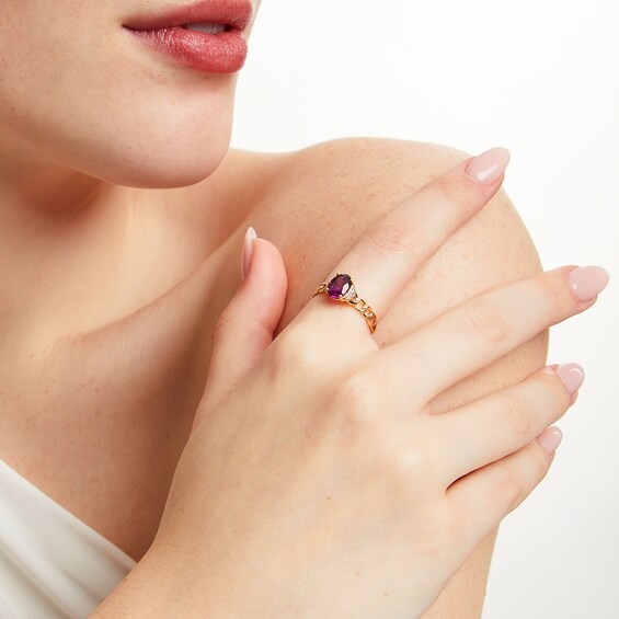 Oval Rhodolite Garnet and 1/20 CT. T.w. Diamond Chain Shank Ring in 10K Gold