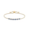 Thumbnail Image 1 of Oval Blue Sapphire and 1/8 CT. T.W. Diamond Alternating Bolo Bracelet in 10K Gold - 9"