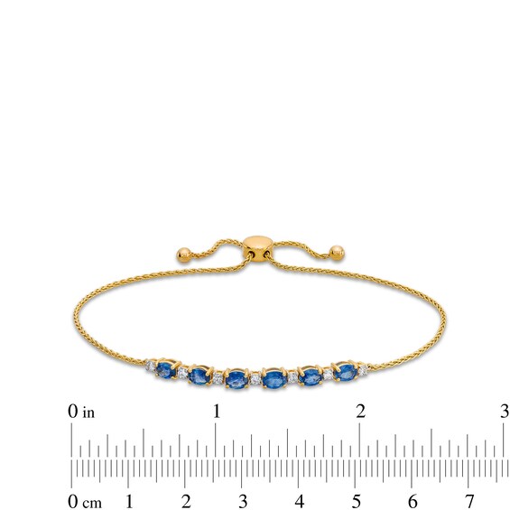 Oval Blue Sapphire and 1/8 CT. T.w. Diamond Alternating Bolo Bracelet in 10K Gold - 9"