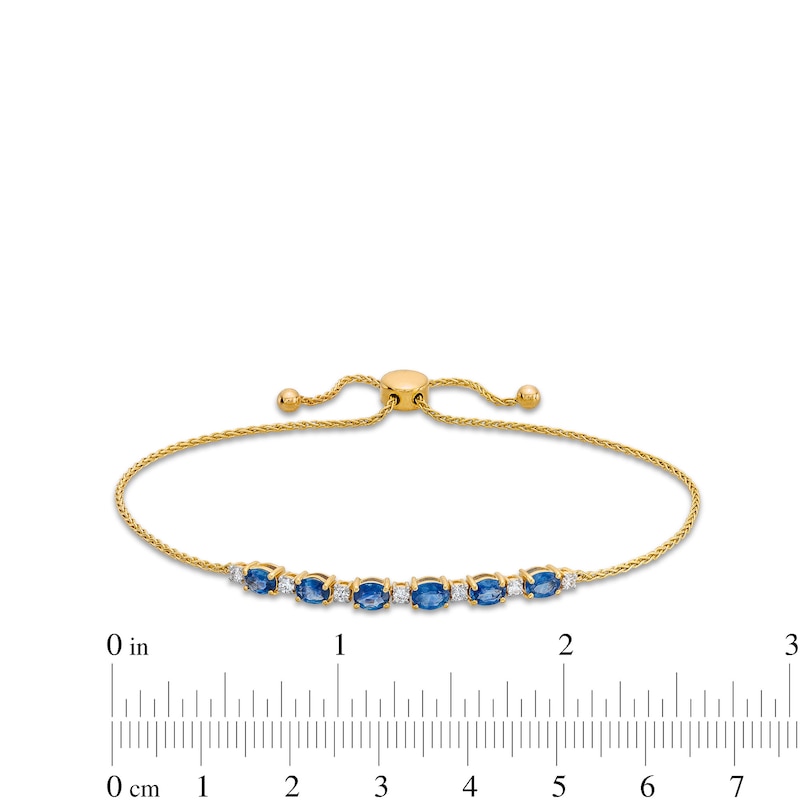 Main Image 3 of Oval Blue Sapphire and 1/8 CT. T.W. Diamond Alternating Bolo Bracelet in 10K Gold - 9"