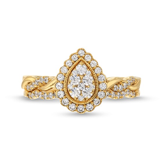 1/2 CT. T.w. Diamond Pear Frame Twist Shank Bridal Set Ring in 10K Gold