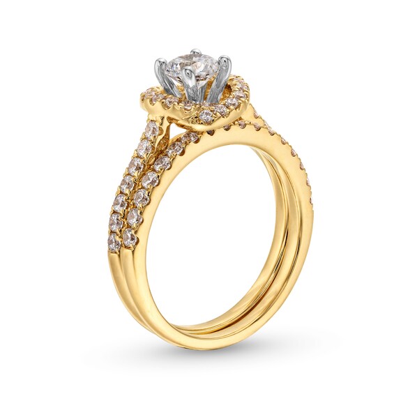 1-1/6 CT. T.w. Diamond Swirl Frame Bridal Set in 14K Gold
