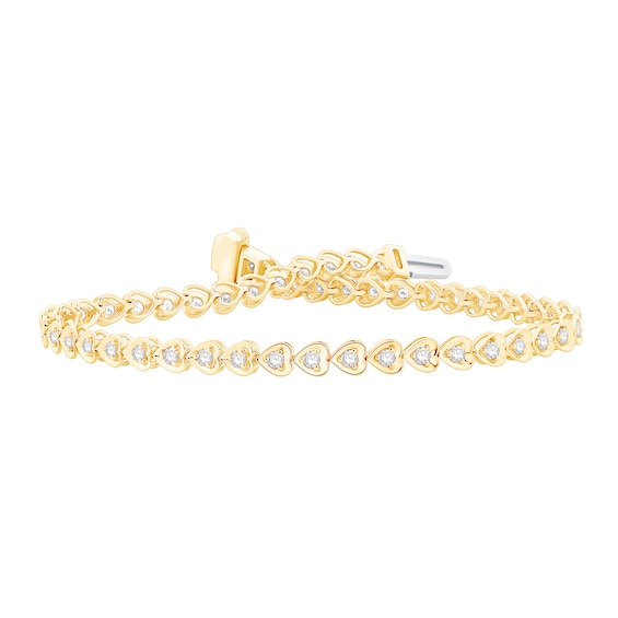 1 CT. T.w. Diamonds Hearts Line Bracelet in 10K Gold - 7.25"