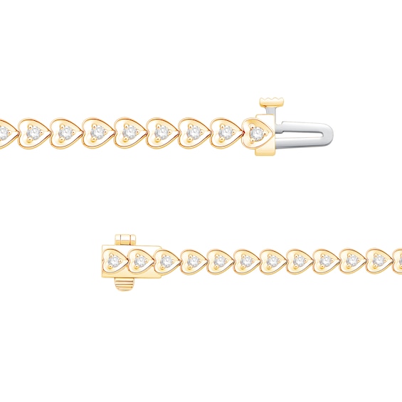 1 CT. T.w. Diamonds Hearts Line Bracelet in 10K Gold - 7.25"
