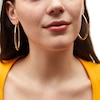 Thumbnail Image 1 of 57.0mm Oval Hoop Earrings in Sculpted Hollow 14K Gold