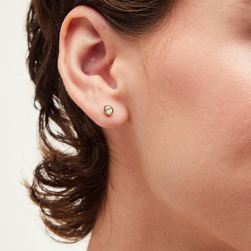 Main Image 2 of 3/8 CT. T.W. Oval Diamond Bezel-Set Solitaire Stud Earrings in 14K Gold