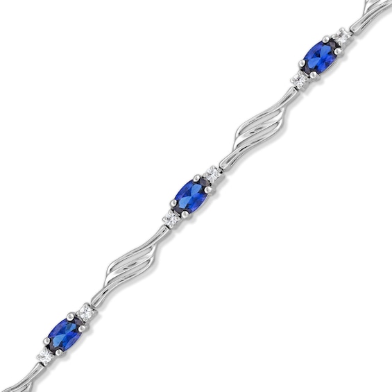 Oval Blue and White Lab-Created Sapphire Bypass Wave Alternating Line Bracelet in Sterling Silver - 7.25"